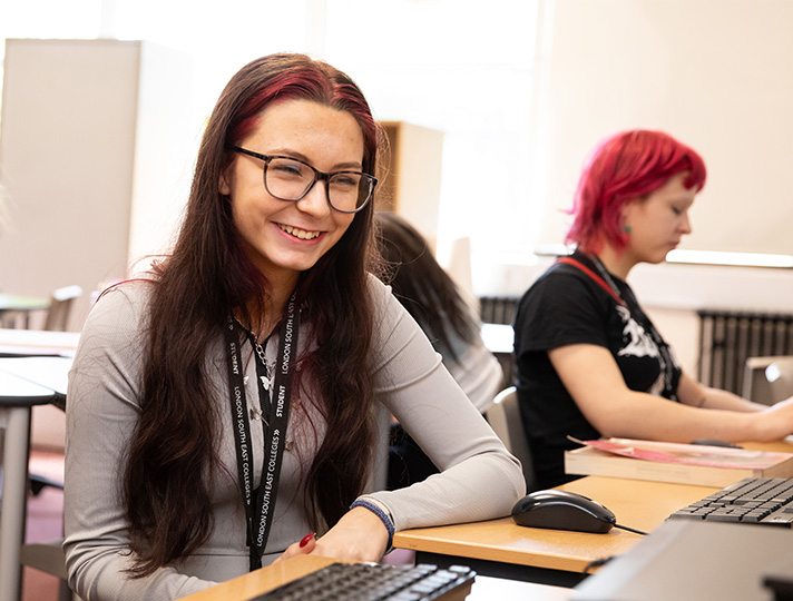 Student working at a desk in classroom